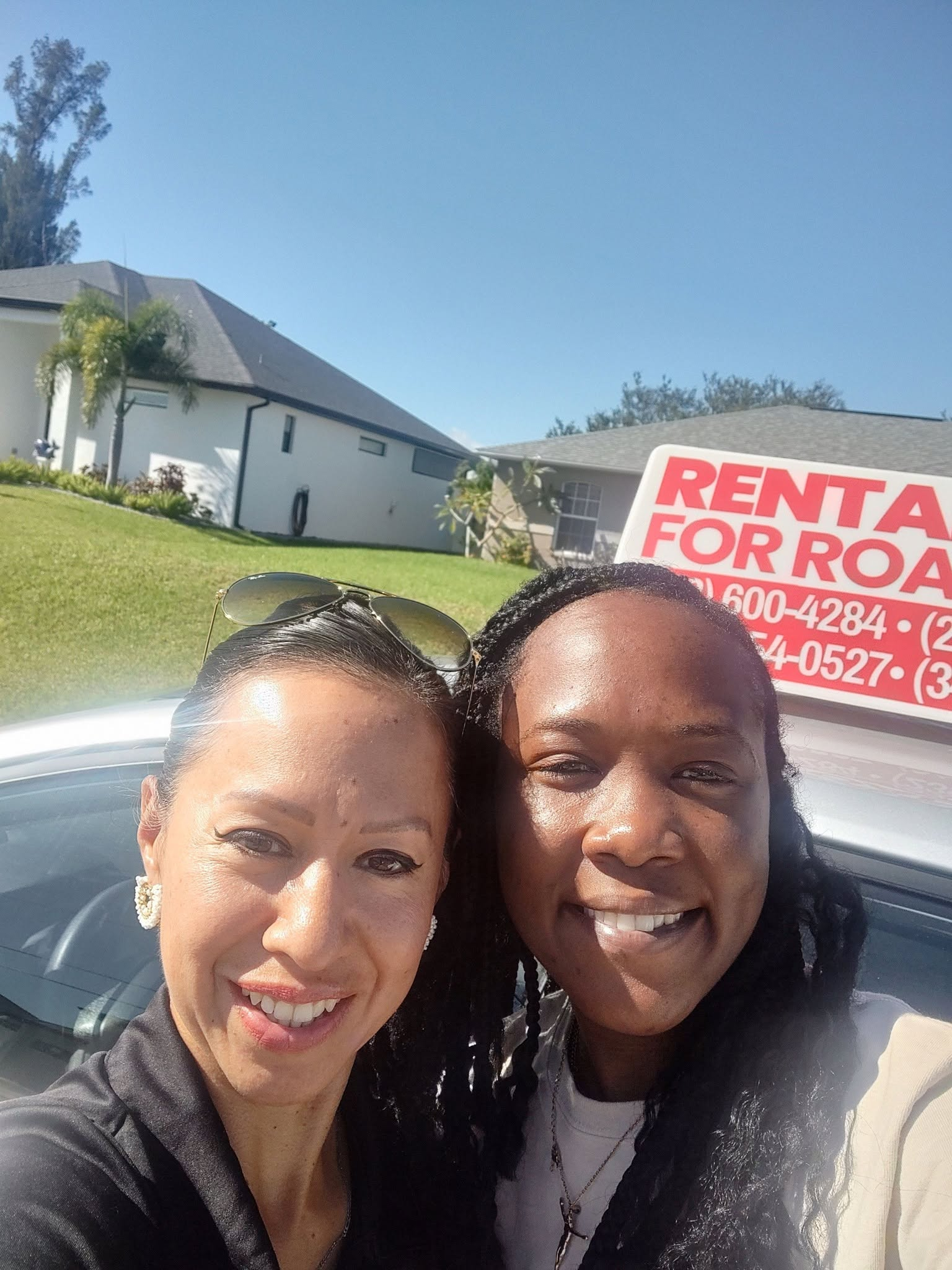 Our instructor celebrating with a happy student next to the road test car