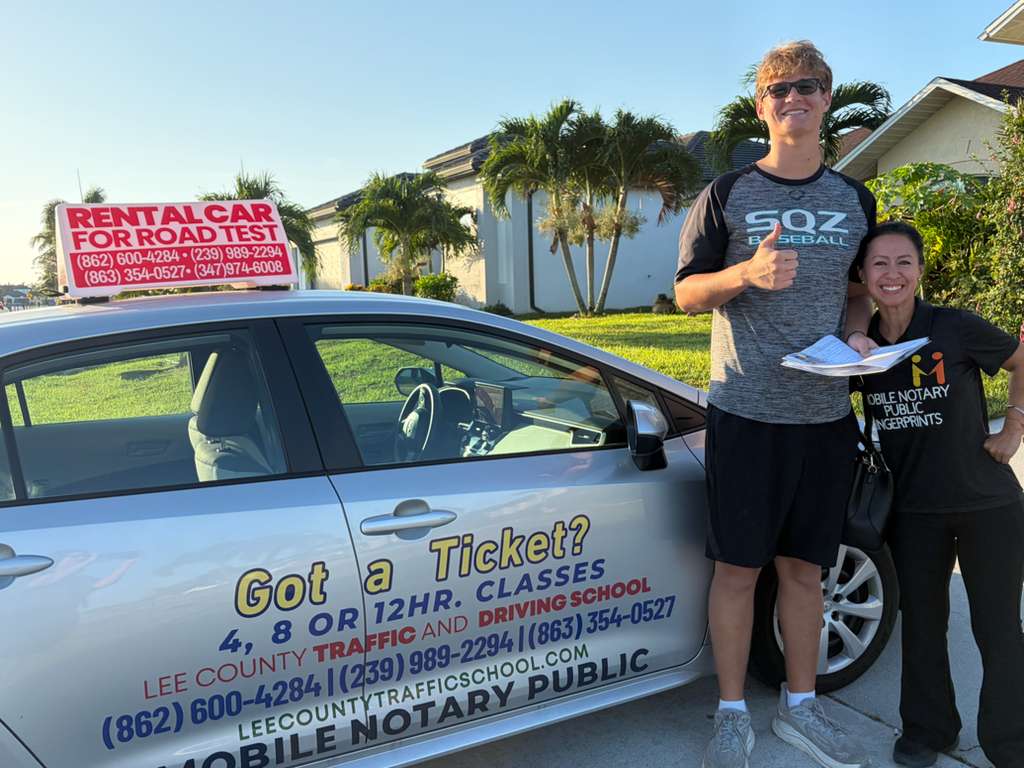 Our instructor with a smiling student after passing his road test in Cape Coral